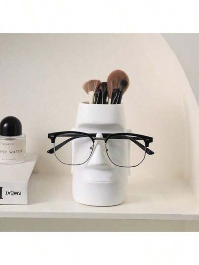 1 pièce Support de stylo créatif en forme de statue de Moaï pour le bureau et la coiffeuse, un organisateur de décoration en résine durable pour les pinceaux de maquillage, les crayons et les petits outils, un accessoire de bureau de style maison chic, un organisateur de bureau économe en espace, une pièce de conversation unique, un cadeau pratique pour les amis et les collègues, une touche moderne et chic pour le bureau, un aménagement de coiffeuse confortable