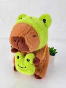 Juguete de peluche adorable de Capibara de 22 cm/8,66 pulgadas con tapa de cabeza de rana y mochila de rana. Estilo de anime de animal de peluche de color marrón oscuro. Regalo perfecto para fans de anime, decoración creativa y regalos para la fiesta de cumpleaños de niños, decoración de habitación de niñas.