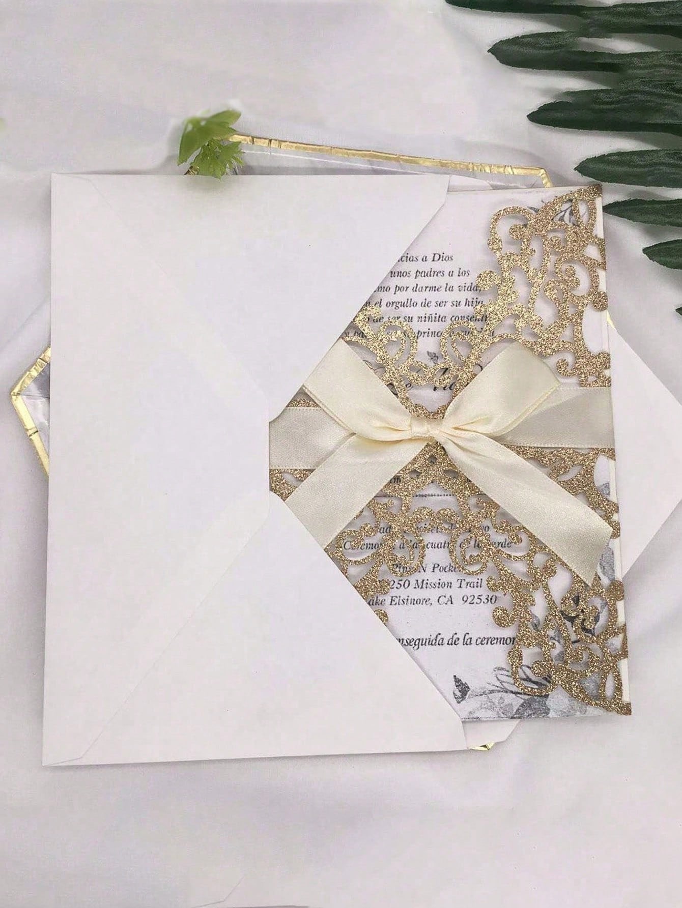 20 wedding invitation cards in the shape of a shiny gold flower, hollowed out, with envelope and response cards, tied with satin r...