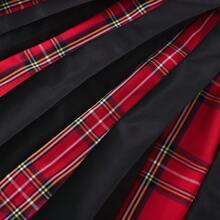 Nuevo diseño popular de estilo europeo y americano Falda escocesa de hombre con vacaciones a cuadros, costura de contraste de color y pliegues, a cuadros rojos y negros