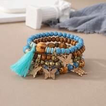 Set de 4 pulseras de estilo bohemio multicapa con cuentas y borlas, colgante de mariposa, joyería de moda como regalo