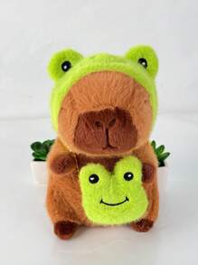 Juguete de peluche adorable de Capibara de 22 cm/8,66 pulgadas con tapa de cabeza de rana y mochila de rana. Estilo de anime de animal de peluche de color marrón oscuro. Regalo perfecto para fans de anime, decoración creativa y regalos para la fiesta de cumpleaños de niños, decoración de habitación de niñas.