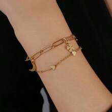 Exportation transfrontalière vers l'Europe et les États-Unis Bracelet minimaliste en acier inoxydable à double couche avec pendentif trefle à quatre feuilles, lune et arbre de vie. Cadeau de bijoux pour femmes pour la famille et les amis