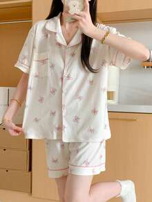 两件套女士睡衣套装，粉色装饰蝴蝶结图案，翻领单排扣，短裤和短袖，宽松，女士家居服睡衣