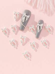 10pcs 0.9*1.5cm Silver Base Metal & Rhinestones Bowknot Nail Art Decoration