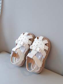 新款女童幼儿蝴蝶结镂空花朵设计凉鞋，软底防滑小女孩儿童鞋，适合夏季 - 米色 - 查看 3