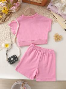 Set de 2 piezas de ropa informal y elegante para niñas, compuesto por sudadera de cuello redondo con gráfico de corazón y manga raglán de manga corta, y pantalones cortos, todo suave, transpirable y cómodo, adecuado para uso diario y vacaciones