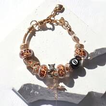 1 pieza Pulsera ajustable con dije de bola 8, dije de estrella y cruz, dije de tiempo y estampado de leopardo, estilo para parejas