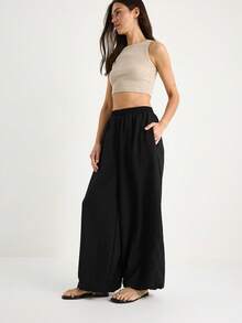 BIANCO LUCCI Women's Solid Color Elastic Waist Pocket Wide Leg Casual Loose Drawstring Pants - Black - View 7