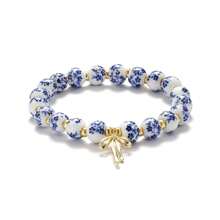 1pc Retro White&Blue Ceramic Bead Bracelet With Bow Pendant, Elastic, Suitable For Women's Daily Wear And Gifts