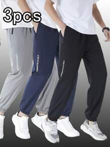 Set de 3 pantalones deportivos de secado rápido de unicolor para hombre, pantalones jogger acampanados con bolsillos y cremallera, adecuados para uso casual, entrenamiento y exteriores