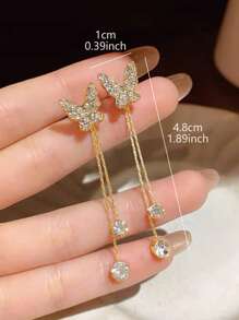 1 paire de boucles d'oreilles papillon en strass élégantes et mignonnes avec des pompons détachables, convient pour le port quotidien et les sorties des femmes