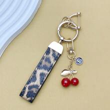 TTOBS 1pc Exquisitely Crafted Leopard Print Leather Car Key Chain With Adorable Cherry Pendant - , Fashionable And Multi-Functional Backpack Keychain - The Perfect Accessory For Backpacks. The Perfect Valentine's Day Gift, Also An Ideal Gift For Your Beloved Girlfriend.