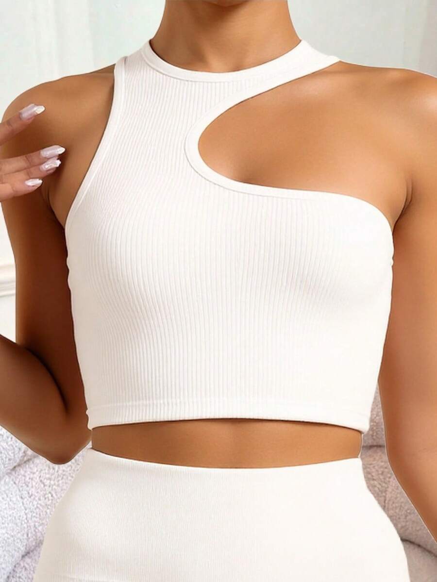 1 PIEZA Top Asimétrico Doble Tela sin Transparencia – Rib Premium | Blanco, Negro y Camel  Luce moderna y sofisticada con este top asimétrico confeccionado en tela rib de máxima calidad. Su diseño único con corte en el escote y acabado entallado realza tu figura de forma elegante y cómoda. Incluye doble tela para evitar transparencias y asegurar un ajuste firme y seguro. Ideal para combinar con jeans, faldas o pantalones de tiro alto. Disponible en los colores esenciales: blanco, negro y camel. Perfecto para salidas, cenas o looks casual chic.  Liso  Casual  Canalé  Canalé    escote asimetrico  Diario  primavera-verano - Blanco - Ver 1
