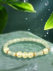 Una pulsera elástica de cuentas transparentes con cadena de bambú articulado, elegante y sofisticada, que simboliza la riqueza y la prosperidad. Adecuada para el uso diario, ocasiones de citas y un regalo pequeño y delicado.