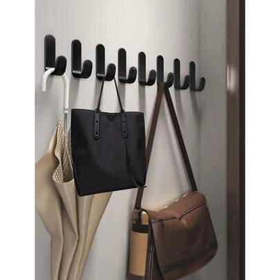 Conjunto de 6 mini ganchos adesivos reforçados em formato de J, que não danificam a parede, ideais para uso em paredes e portas. Instalação sem furos.