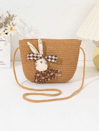 新款女孩草编斜挎包，轻巧时尚，带有可爱的兔子装饰，适合海滩、旅行、购物