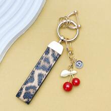 TTOBS 1pc Exquisitely Crafted Leopard Print Leather Car Key Chain With Adorable Cherry Pendant - , Fashionable And Multi-Functional Backpack Keychain - The Perfect Accessory For Backpacks. The Perfect Valentine's Day Gift, Also An Ideal Gift For Your Beloved Girlfriend.