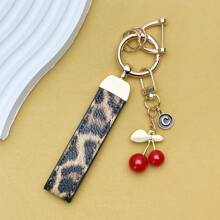 TTOBS 1pc Exquisitely Crafted Leopard Print Leather Car Key Chain With Adorable Cherry Pendant - , Fashionable And Multi-Functional Backpack Keychain - The Perfect Accessory For Backpacks. The Perfect Valentine's Day Gift, Also An Ideal Gift For Your Beloved Girlfriend.