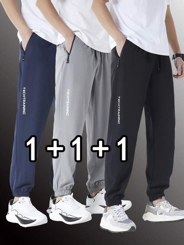 Set de 3 pantalones deportivos de secado rápido de unicolor para hombre, pantalones jogger acampanados con bolsillos y cremallera, adecuados para uso casual, entrenamiento y exteriores