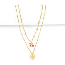 2 pièces/set Simples pendentifs en forme de cœur à motif creux et initial, chaîne dorée à lèvres, colliers multicouches en acier inoxydable pour femmes