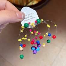 Boucles d'oreilles pendantes minimalistes à pampilles colorées en forme d'étoile, à la mode et polyvalentes pour femmes