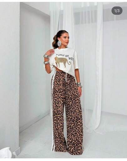 Calça pantalona track pants wid leg, listra lateral, elástico na cintura, bolso, tecido marrant