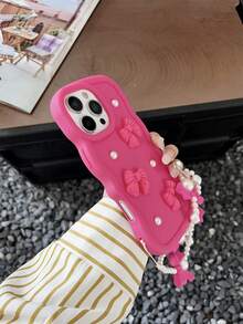 粉色波浪蝴蝶结硅胶大波浪马卡龙手机壳，带腕带，3D仿珍珠装饰，新颖独特，兼容三星Galaxy S25、S24、S24 Plus/S24+、S24 Ultra、S24 FE、S20、S21、S22、S23以及苹果11/11 Pro/11 Pro Max、12/12 Pro/12 Pro Max、13/13 Pro/13 Pro Max、14/14 Pro/14 Pro Max、15/15 Pro/15 Pro Max、16/16 Pro/16 Pro Max、16E。产品特点包括心形握柄、配套挂绳、防震保护、硅胶外壳保护摄像头和屏幕、防水防摔、防刮擦。是女性节日礼物和生日庆祝的理想之选。 - 玫紅色 - 查看 3