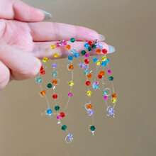 Boucles d'oreilles pendantes minimalistes à pampilles colorées en forme d'étoile, à la mode et polyvalentes pour femmes