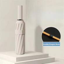 12 Paraguas Automático de Pegamento Negro con Quilla Gruesa y Duradera, Paraguas Plegable de Tres Secciones Resistente a los Rayos UV - D - Ver 3