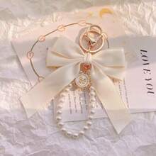 1 件华丽哑光蝴蝶结仿珍珠钥匙扣，可爱的仿珍珠串珠手链，复古饰品，适合女士/女孩钱包、袜子、背包、汽车、丝带、珍珠吊坠、情人节、蝴蝶结钥匙扣、学校用品、教师礼物、返校教师配件、情人节汽车配件包饰背包学校可爱哥特 Y2k - 米色 - 查看 5