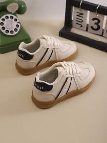 1 par de tênis esportivos infantis de cor sólida com cadarço, sola macia e respirável, tênis casuais adequados para meninos e meninas, corrida ao ar livre, todas as estações