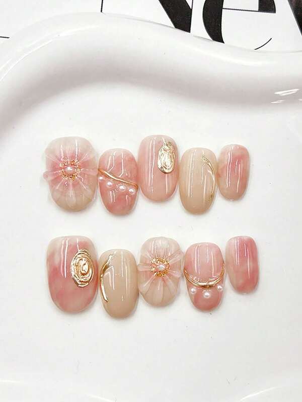 10 Handmade Oval Shaped Nails With Light Luxury And High-End Pink As The Main Color, Paired With Gilded Design. Detachable And Reusable, Suitable For Daily Use By Women Of Different Styles