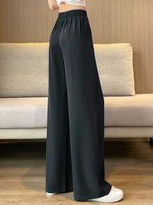 بنطال نسائي عادي أنيق ذو ساق واسعة مستقيمة فضفاض ذو جيوب جانبية منسدلة، مناسب لارتداء مكتبي خلال الربيع أو للمناسبات العادية