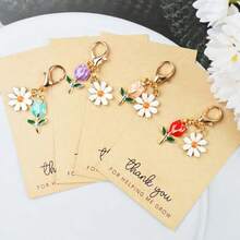 Set de 4 llaveros con dijes de margarita y corazón que dicen "Gracias por ayudarme a crecer" - Perfecto para agradecer a maestros, familia y amigos | Ideal para cumpleaños, graduaciones, bodas, accesorios escolares, accesorios góticos y de Y2K, ideas de regalo para el Día del Maestro, Navidad, accesorios para bolsos, portaidentificaciones, accesorios para autos - Multicolor - Ver 8