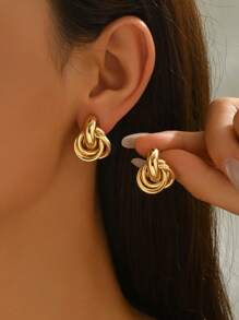 1 Paar minimalistische personalisierte Mode kreative Nische Design goldene Twist Creolen, geeignet für den täglichen Gebrauch von Frauen