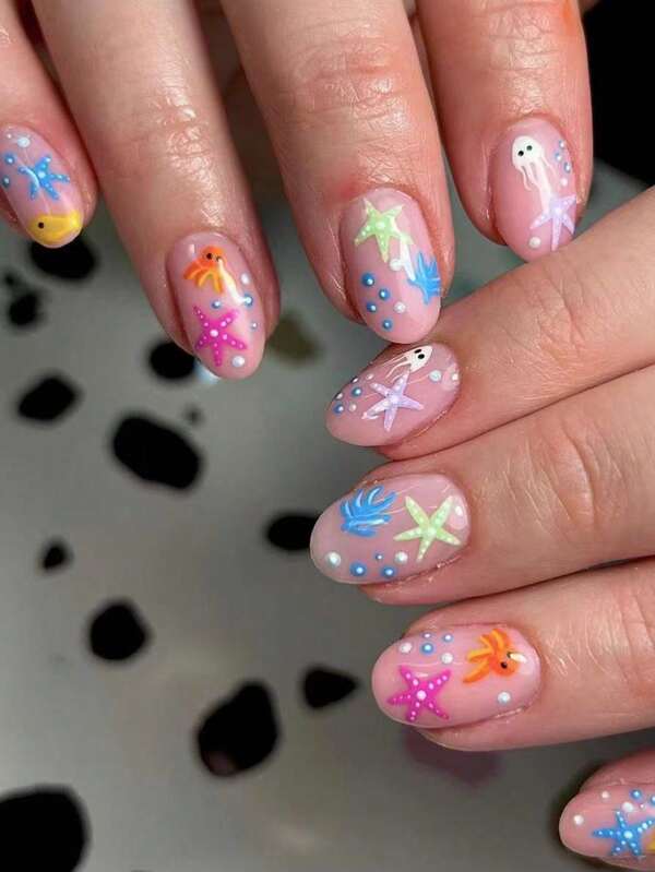 24 pièces/set Série océanique mignonne Patch à presser Faux ongles courts style français avec motifs de pieuvre et étoile de mer. Convient pour la vie quotidienne des filles/femmes. Convient pour les sorties et autres occasions. + 1 x Gel gelatineux + 1 x Lime à ongles Décorez vos ongles avec des ongles DIY!