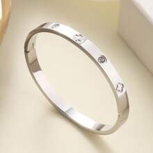 Pulsera de acero inoxidable plateado de estilo elegante decorada con flores de circonita, adecuada para el uso diario de las mujeres
