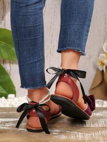 新款大码女式舒适简约圆头珍珠蝴蝶结装饰平底凉鞋，休闲时尚一脚蹬沙滩拖鞋，夏季