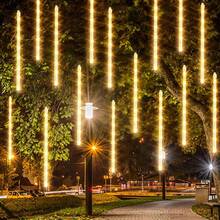 Decoraciones de luces brillantes para el 4 de julio, luces de lluvia de meteoros de 288 LED en rojo, azul y blanco de 12 pulgadas con 8 tubos, luz de lluvia en caída impermeable y enchufable para el Día de la Independencia para exteriores y jardín - Blanco cálido - Ver 5