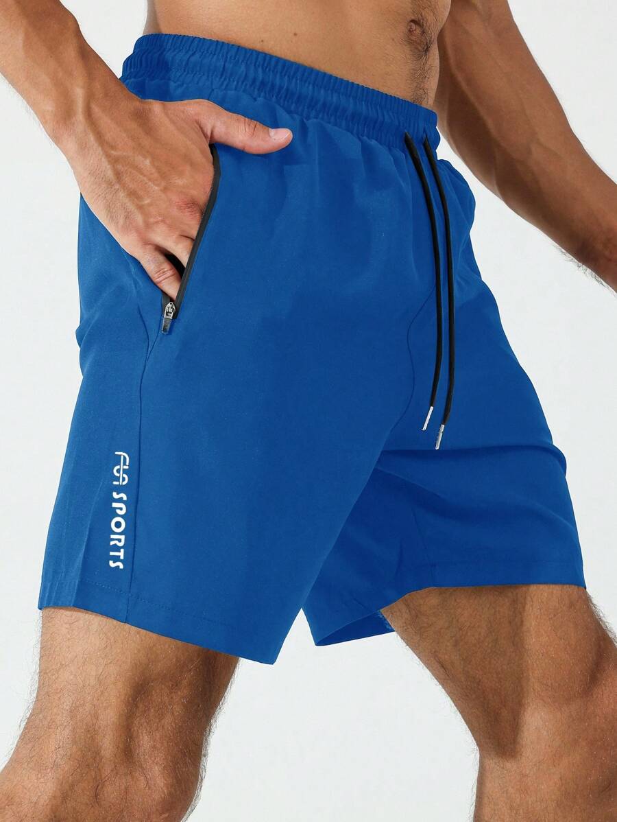 Sport Men Letter Graphic Zipper Pocket Sports Stretchy Shorts