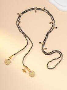 1 collier et 1 paire de boucles d'oreilles, collier de perles noir et doré moyen-oriental, ensemble de bijoux vintage en or ton, collier multicouche exotique, collier contrastant noir et doré, collier à pendentif rond sculpté. Le collier de perles noir et doré évoque le rythme mystique des clochettes de chameaux des nuits étoilées du désert moyen-oriental. Porter cet ensemble de bijoux est un identificateur unique d'une promenade dans un marché moyen-oriental.