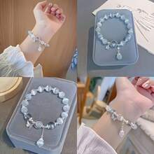 2 pièces - Bracelet pendant élégant en perles de verre en forme d'étoile - Bijou noble imitation œil de chat pour femmes, thème de fête transparent bleu, cadeau de la Saint-Valentin et de Noël, 15+, design exquis, artisanat exquis, accessoires de mode, bijoux pour adolescentes
