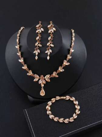 Conjunto de joyería nupcial y de dama de honor de 4 piezas con rhinestones, compuesto por un elegante collar de hojas con ojo de caballo en forma de punta, pendientes y pulsera, adecuado como accesorio para mujeres en una boda o fiesta