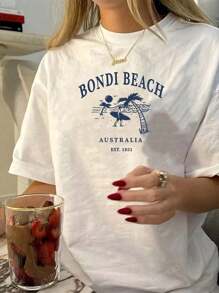 maglietta estiva di moda a stampa con motivo da spiaggia e surf, taglie comode per donna