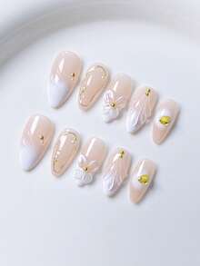 10 piezas de uñas postizas con forma de almendra decoradas con polvo de espejo dorado francés, olas de agua azules, espirales azules y amarillas, y cristales, adecuadas para cualquier ocasión, de rápida colocación, para mujeres y niñas, de moda lujosa y exquisita de alta gama y desmontables