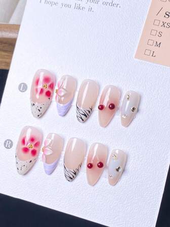 10 pezzi di unghie francesi fatte a mano a forma di mandorla: motivo a zebra, fiore a 5 petali rosso, gemma di quarzo ciliegia rossa, decorazione con perline dorate, fiori realizzati a mano, foglia d'oro, diamante, set di unghie staccabili di lusso ed elegante