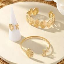 Set de 3 piezas con tema marino, brazalete y anillos abiertos con estrellas de mar y conchas