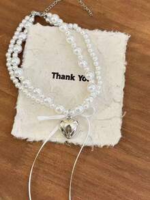 1 chiếc vòng cổ nữ kiểu Pháp, mặt dây chuyền hình trái tim và nơ hai lớp đính ngọc trai, vòng cổ choker thời trang thanh lịch. - Dây chuyền hai lớp - Xem 9