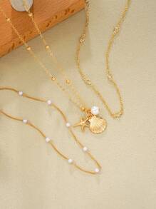 Set de 3 collares elegantes de estilo de moda para vacaciones en la playa con colgantes de estrella de mar, concha, perla falsa y rhinestone, juegos de collares de encanto de metal brillante para fiestas, regalos y uso diario